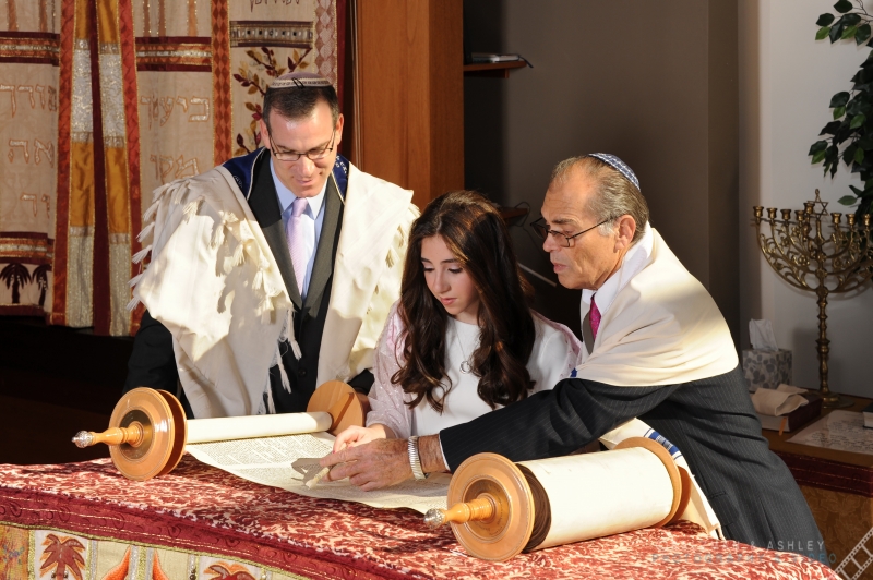 Girl Reading At Bat Mitzvah With Rabbi