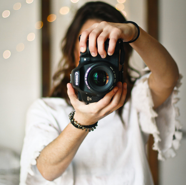 Small Wedding Budget - Friend Photographer - Woman Holding Up A Digital Camera